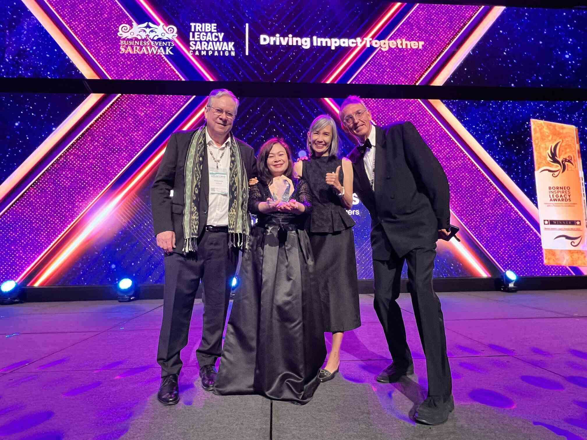 Amelia Roziman (centre) with Gary Grimmer (far left), Jane Vong-Holmes (The Iceberg Ambassador), and James Latham, Founder and Producer of The Iceberg (far right).